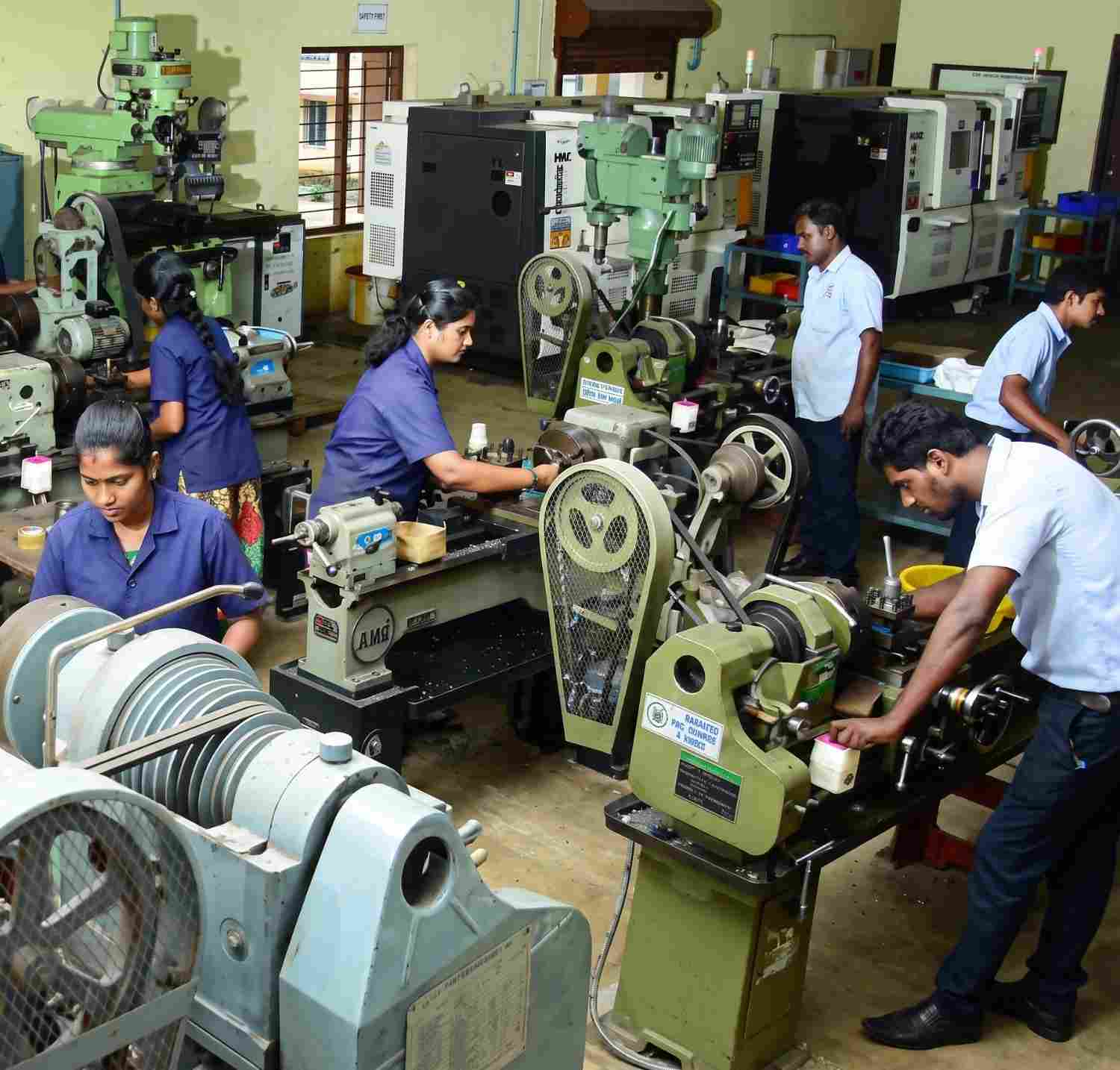 Engineer inspecting a precision machined metal component on the shop floor